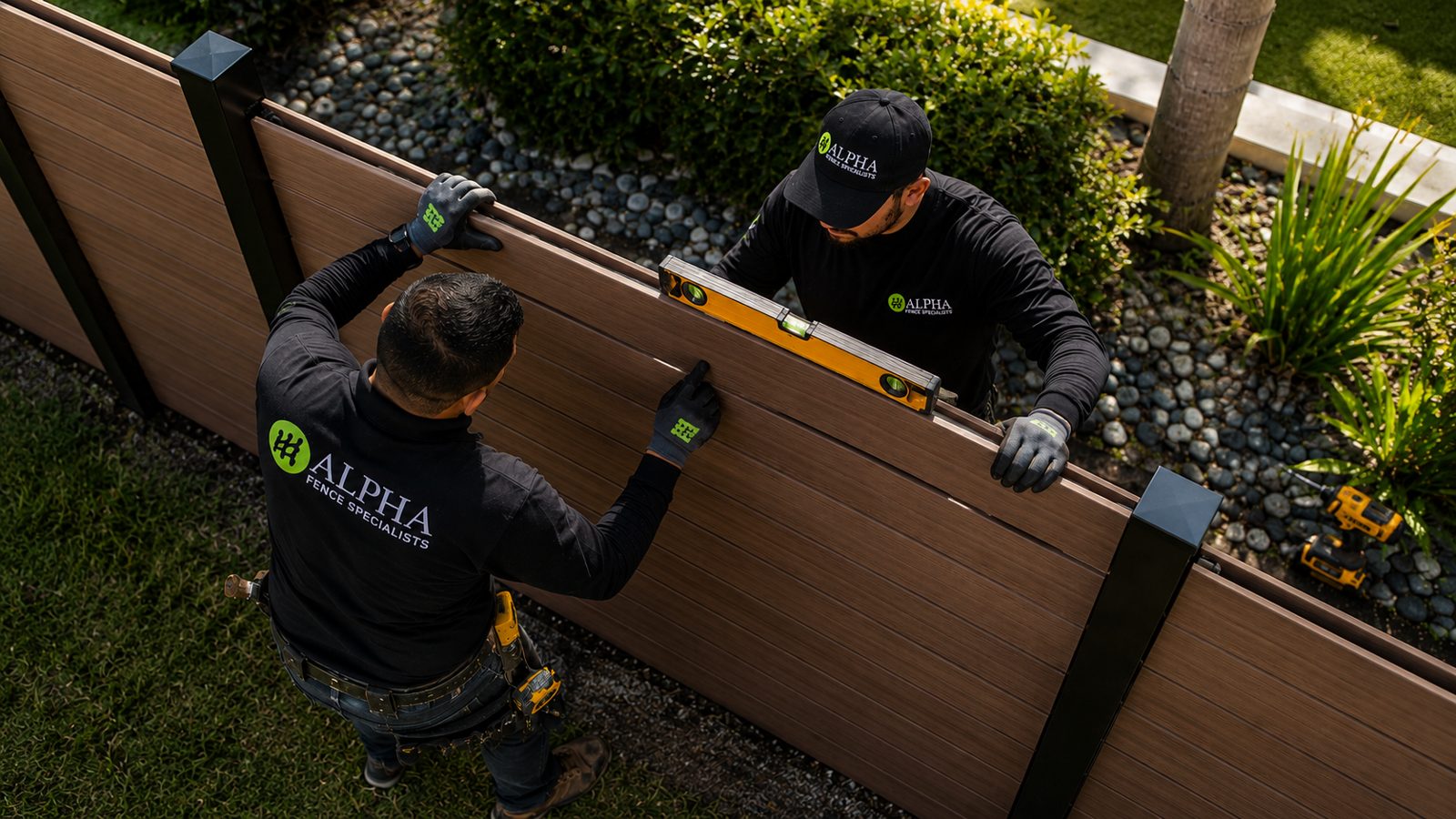 Alpha Fence Specialists crew installing pool fence in Pompano Beach